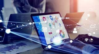 A man typing on a laptop