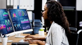 A woman working on a laptop